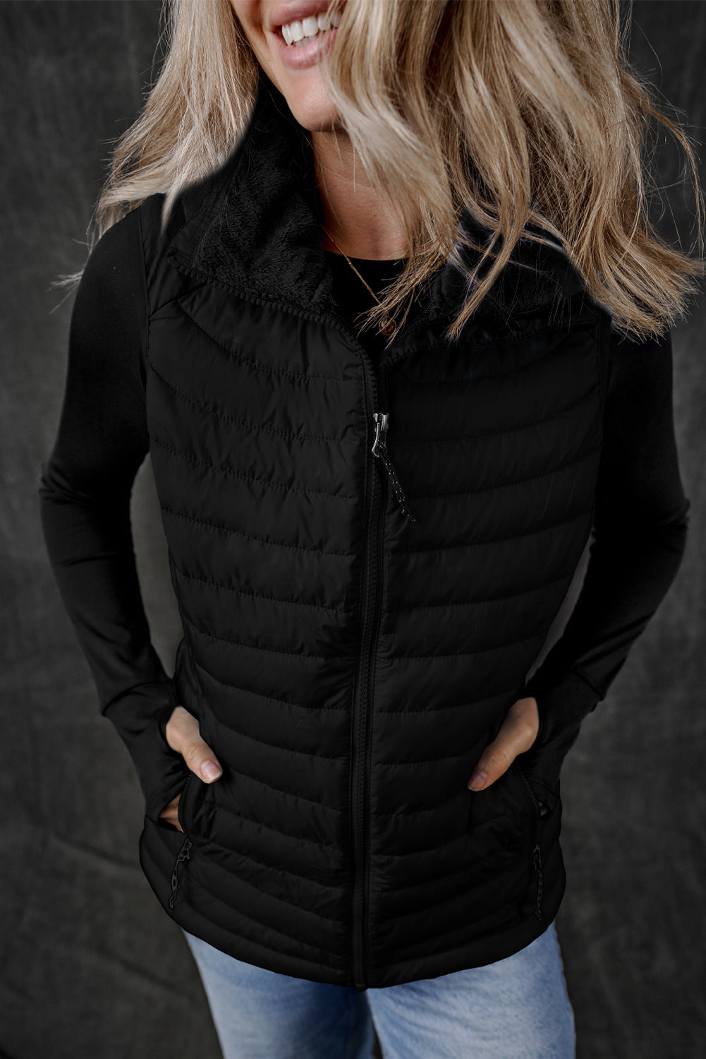 Stay on trend (and warm!) with this Black Quilted Zipped Puffer Vest. Versatile for any occasion, this vest is perfect for layering over any outfit. Plus, its unique quilted design and zip closure add a touch of style. Don't miss out on this must-have piece! front view zipped
