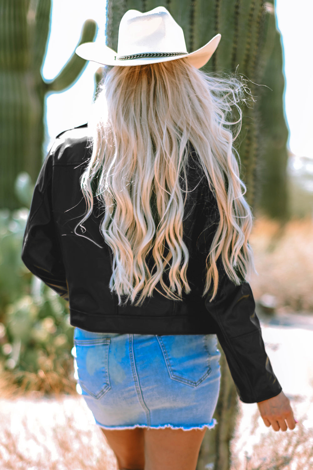 Unleash your inner rebel with our Black Faux Leather Zipper Jacket. Featuring a lapel collar and stylish design, this jacket is the perfect addition to any outfit. Make a statement and stay on-trend with this must-have piece. back view