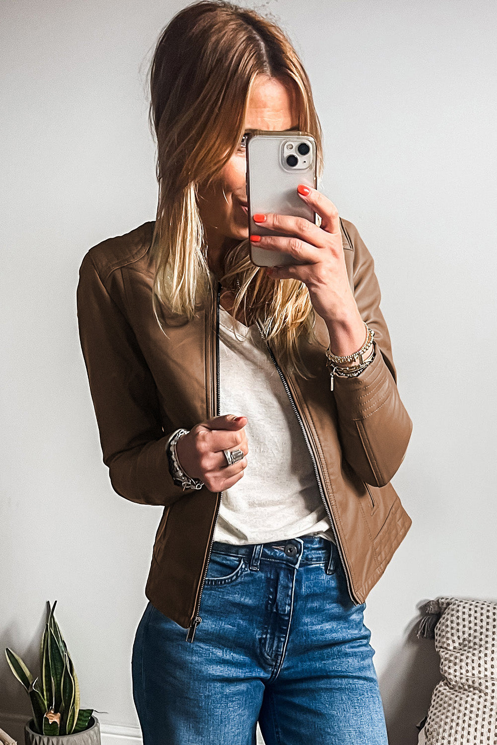 Blond woman wearing Chestnut faux leather slim fit bomber jacket. Front open view