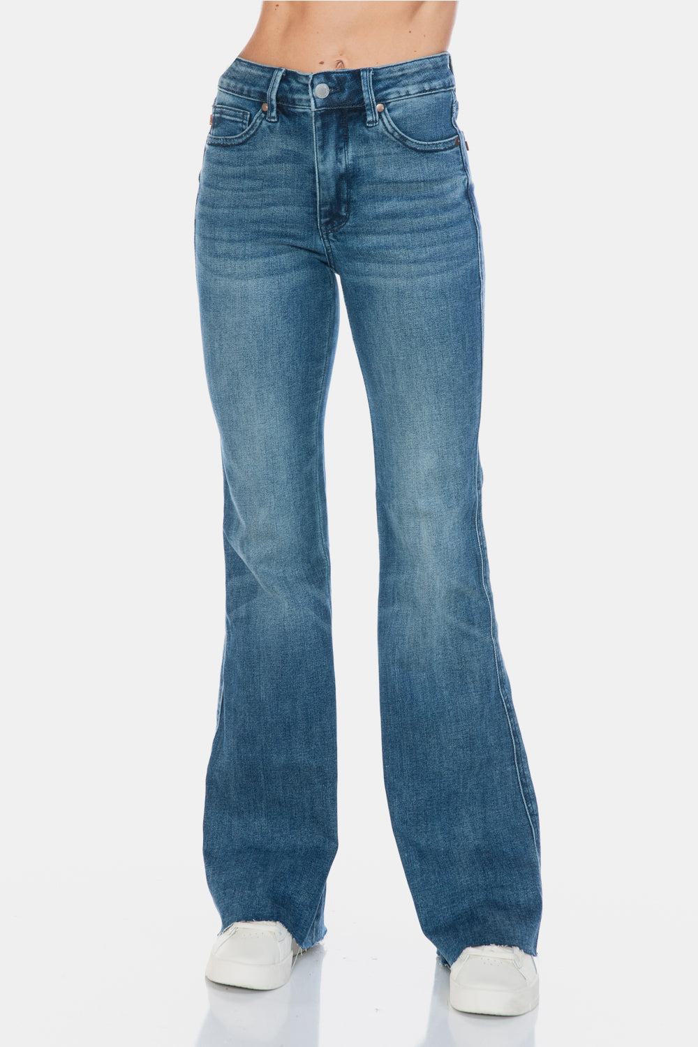 Judy Blue Mid-Rise Tummy Control Vintage Wash Cut Hem Flare is a stylish and flattering pair of jeans. With its tummy control feature, it helps create a streamlined silhouette. The vintage wash gives it a classic and timeless look. The cut hem flare adds a modern twist to the design. Perfect for any occasion, these jeans are versatile and comfortable to wear. Elevate your wardrobe with the Mid-Rise Tummy Control Vintage Wash Cut Hem Flare! Front view