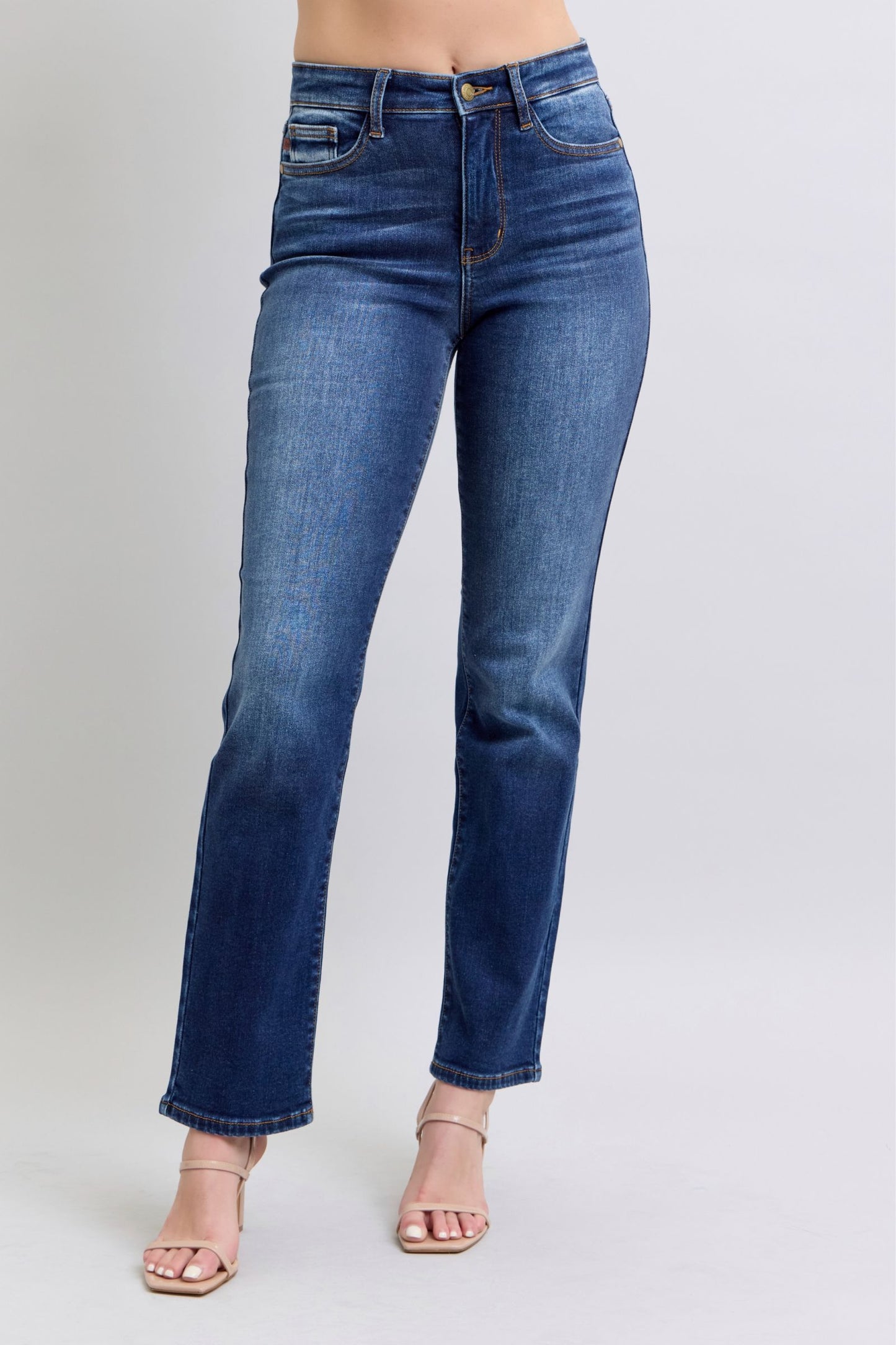 Judy Blue Washed Straight Leg Jeans with Pockets are a practical and fashionable choice for your everyday wardrobe. The washed finish gives them a laid-back and casual feel, while the straight leg cut offers a flattering silhouette. The addition of pockets adds functionality and convenience, making these jeans a perfect blend of style and practicality. Front view