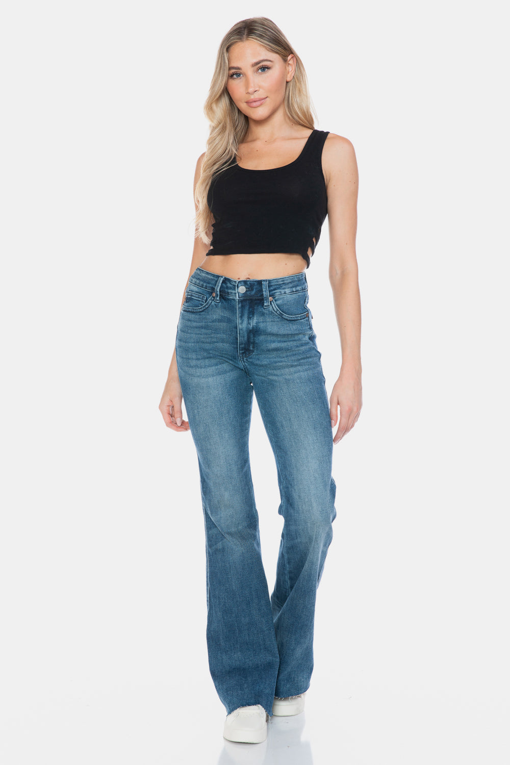 Judy Blue Mid-Rise Tummy Control Vintage Wash Cut Hem Flare is a stylish and flattering pair of jeans. With its tummy control feature, it helps create a streamlined silhouette. The vintage wash gives it a classic and timeless look. The cut hem flare adds a modern twist to the design. Perfect for any occasion, these jeans are versatile and comfortable to wear. Elevate your wardrobe with the Mid-Rise Tummy Control Vintage Wash Cut Hem Flare! Front view