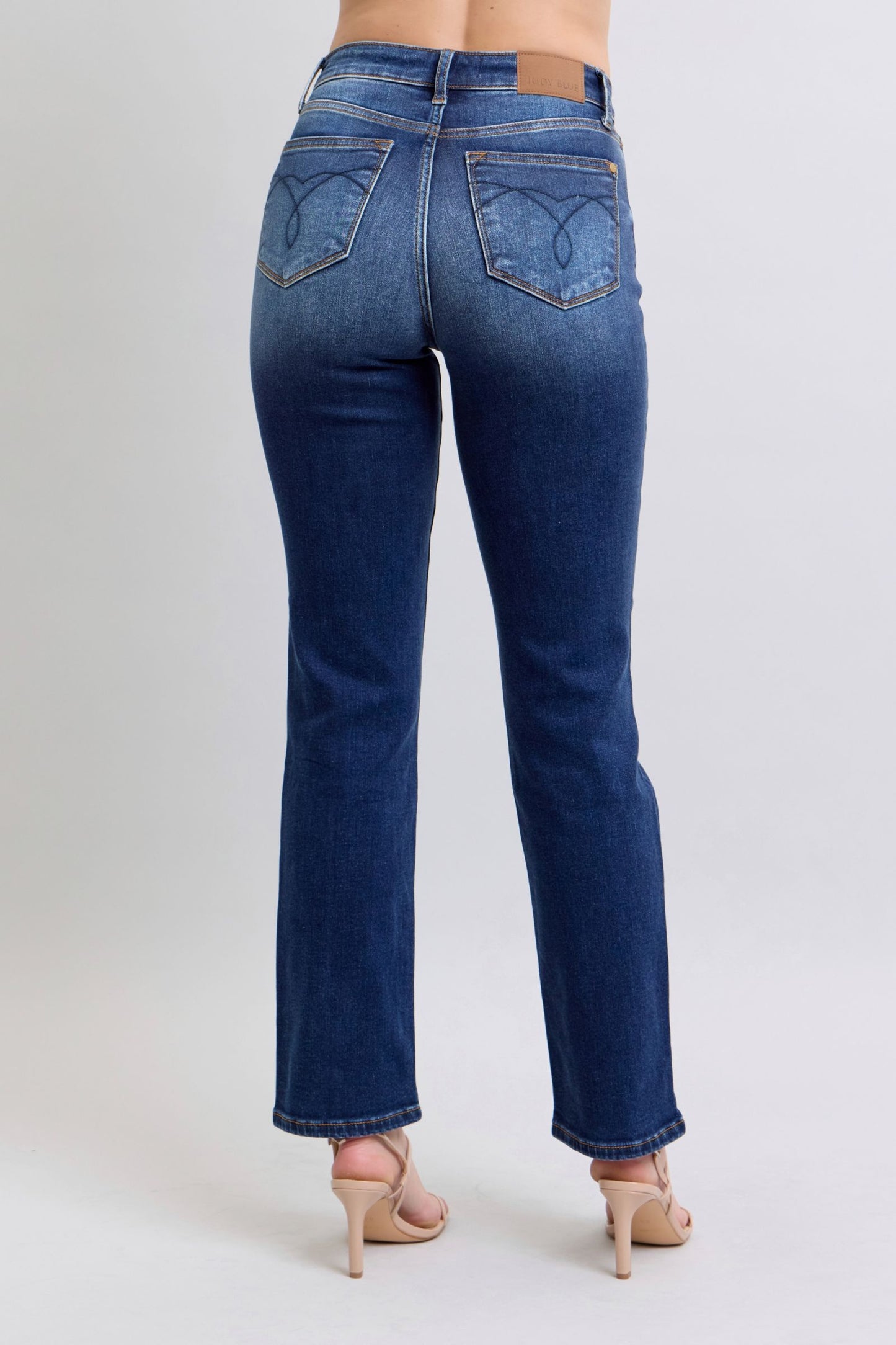 Judy Blue Washed Straight Leg Jeans with Pockets are a practical and fashionable choice for your everyday wardrobe. The washed finish gives them a laid-back and casual feel, while the straight leg cut offers a flattering silhouette. The addition of pockets adds functionality and convenience, making these jeans a perfect blend of style and practicality. Back view
