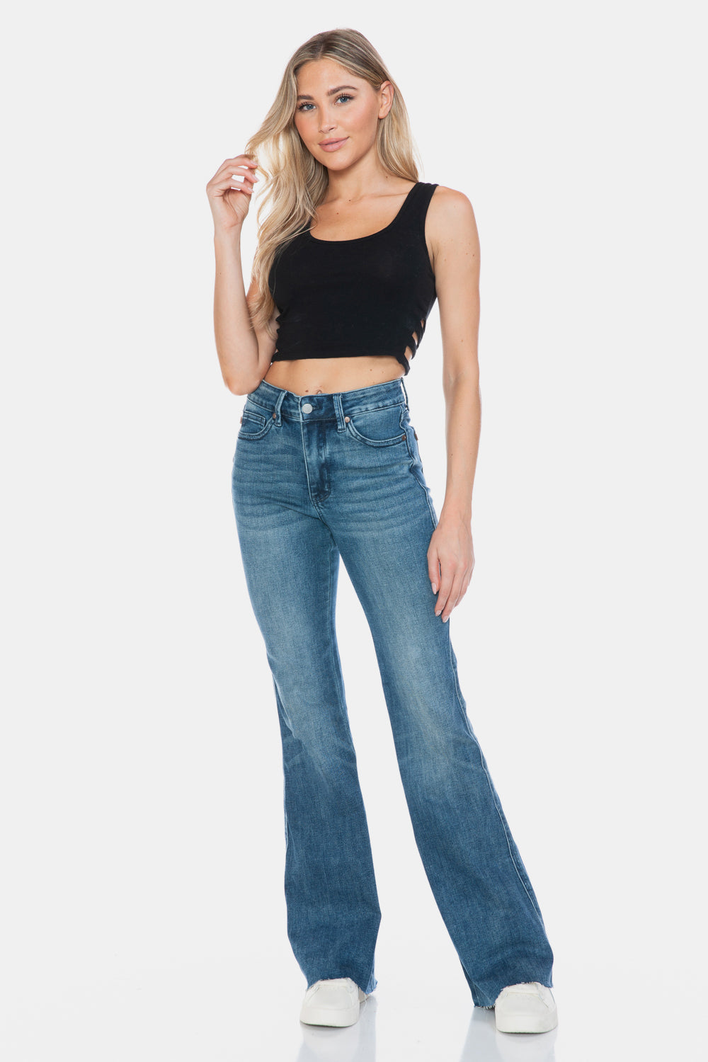 Judy Blue Mid-Rise Tummy Control Vintage Wash Cut Hem Flare is a stylish and flattering pair of jeans. With its tummy control feature, it helps create a streamlined silhouette. The vintage wash gives it a classic and timeless look. The cut hem flare adds a modern twist to the design. Perfect for any occasion, these jeans are versatile and comfortable to wear. Elevate your wardrobe with the Mid-Rise Tummy Control Vintage Wash Cut Hem Flare! Front view