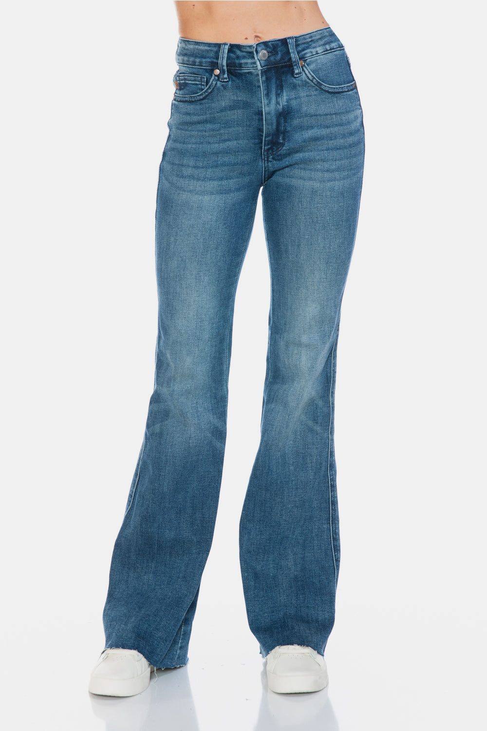 Judy Blue Mid-Rise Tummy Control Vintage Wash Cut Hem Flare is a stylish and flattering pair of jeans. With its tummy control feature, it helps create a streamlined silhouette. The vintage wash gives it a classic and timeless look. The cut hem flare adds a modern twist to the design. Perfect for any occasion, these jeans are versatile and comfortable to wear. Elevate your wardrobe with the Mid-Rise Tummy Control Vintage Wash Cut Hem Flare! Front view