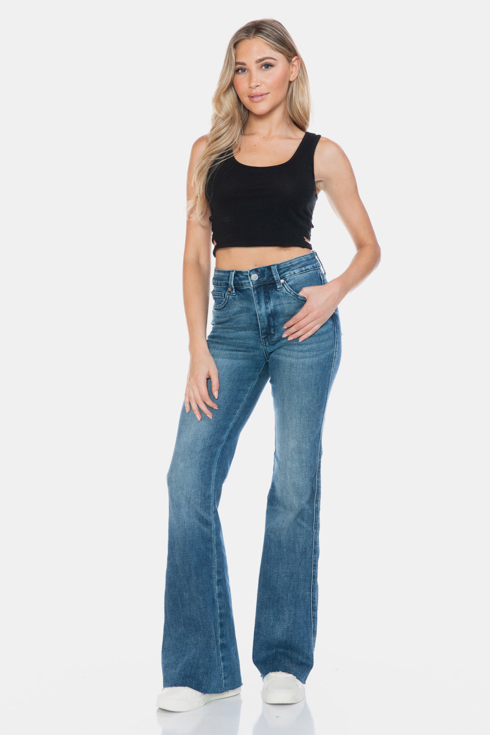 Judy Blue Mid-Rise Tummy Control Vintage Wash Cut Hem Flare is a stylish and flattering pair of jeans. With its tummy control feature, it helps create a streamlined silhouette. The vintage wash gives it a classic and timeless look. The cut hem flare adds a modern twist to the design. Perfect for any occasion, these jeans are versatile and comfortable to wear. Elevate your wardrobe with the Mid-Rise Tummy Control Vintage Wash Cut Hem Flare! Front view