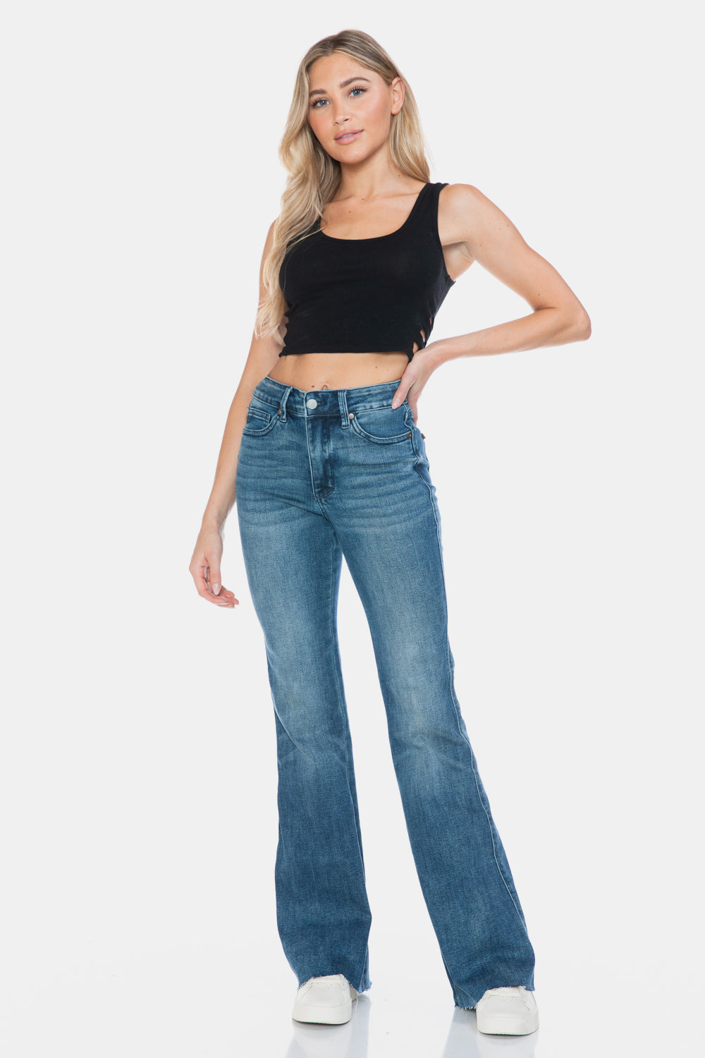 Judy Blue Mid-Rise Tummy Control Vintage Wash Cut Hem Flare is a stylish and flattering pair of jeans. With its tummy control feature, it helps create a streamlined silhouette. The vintage wash gives it a classic and timeless look. The cut hem flare adds a modern twist to the design. Perfect for any occasion, these jeans are versatile and comfortable to wear. Elevate your wardrobe with the Mid-Rise Tummy Control Vintage Wash Cut Hem Flare! Front view