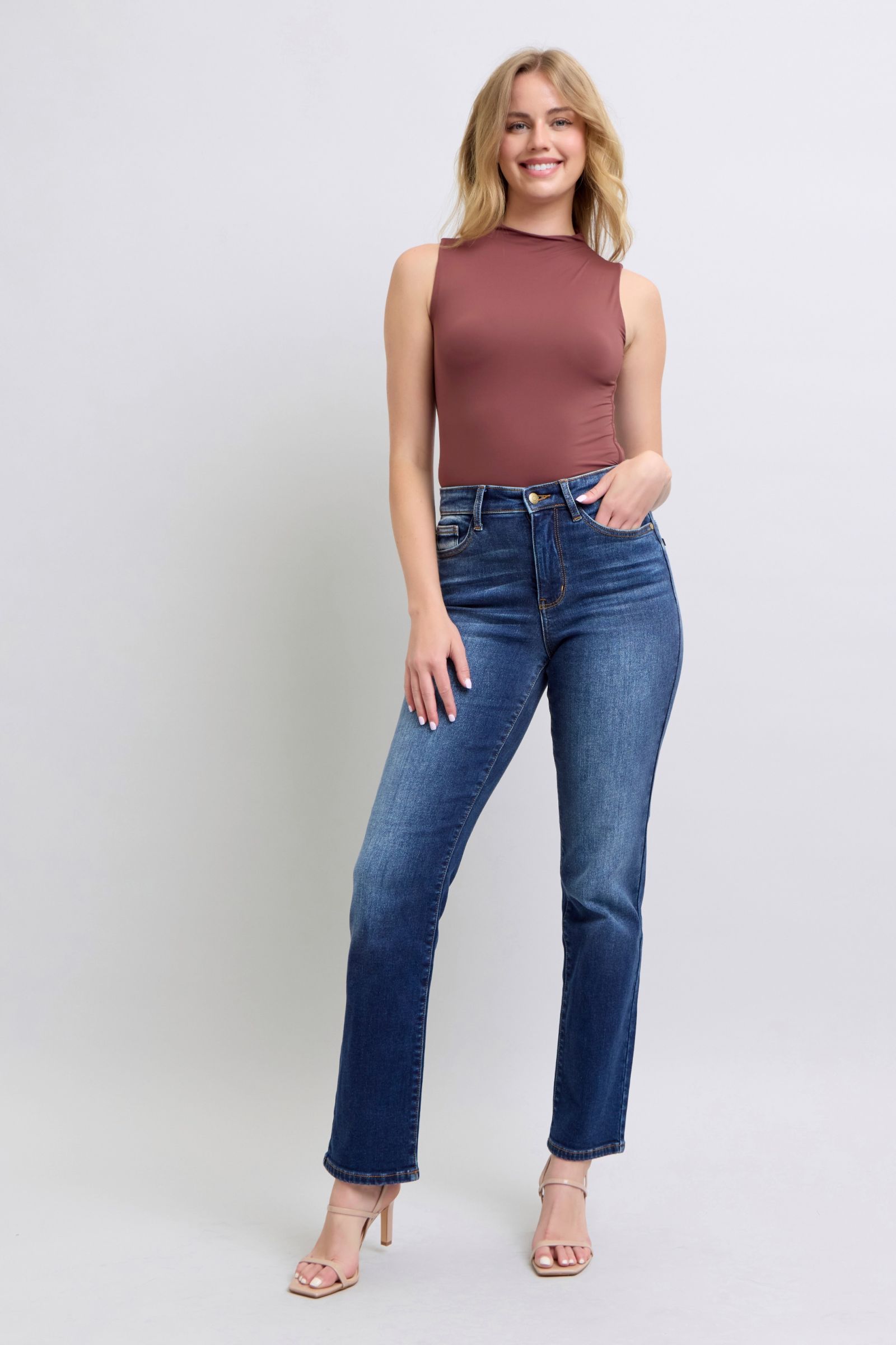 Judy Blue Washed Straight Leg Jeans with Pockets are a practical and fashionable choice for your everyday wardrobe. The washed finish gives them a laid-back and casual feel, while the straight leg cut offers a flattering silhouette. The addition of pockets adds functionality and convenience, making these jeans a perfect blend of style and practicality. Front view