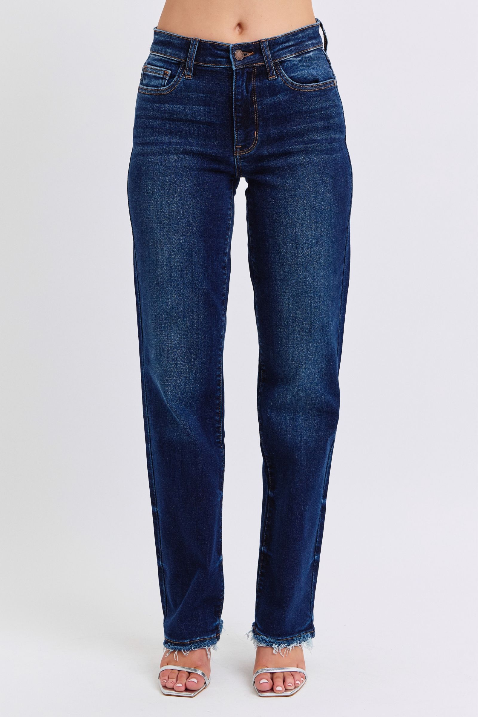 Judy Blue Raw Hem Straight Leg Jeans are a versatile and timeless addition to your wardrobe. The raw hem adds a touch of edge, while the straight leg style offers a flattering silhouette. Perfect for both casual and dressy looks, these jeans are a must-have for any fashion-forward individual. Front view