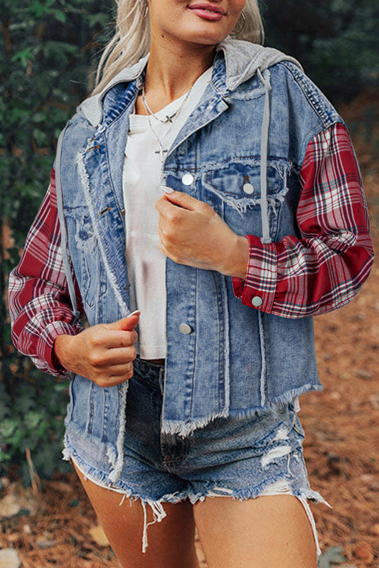 Blond woman wearing denim jacket with red and white plaid sleeves, flap pockets, hood, and button up closure. Front open view